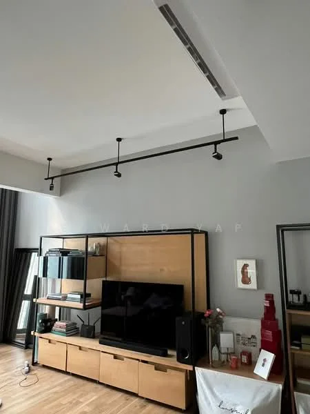 Living features: grey painted walls, wood flooring, recessed ceiling lights, track lighting, TV console with storage, wall-mounted TV, decorative artwork, large windows with sheer curtains, open shelving unit, black accent pieces; style: modern.