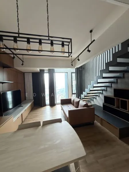 Living features: 3-seater fabric sofa in brown, wooden coffee table, wall-mounted TV, TV console with storage, black accent wall with shelving, large floor-to-ceiling windows, curtains, wooden flooring, industrial-style pendant lighting, staircase with wooden steps and black railing; style: modern; view: city. Kitchen features: open-plan layout, kitchen island with seating, light wood cabinetry, stainless-steel appliances; style: modern.