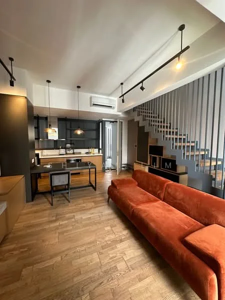 Living features: orange fabric sofa, wooden flooring, recessed downlights, open-plan layout, staircase with metal railing, wall-mounted air conditioning unit, pendant lighting, black dining table, black dining chairs, kitchen island, kitchen cabinetry, glass backsplash, kitchen appliances visible; style: modern. Kitchen features: black cabinetry, stainless-steel appliances, kitchen island with seating, open shelving, white countertops; style: modern.