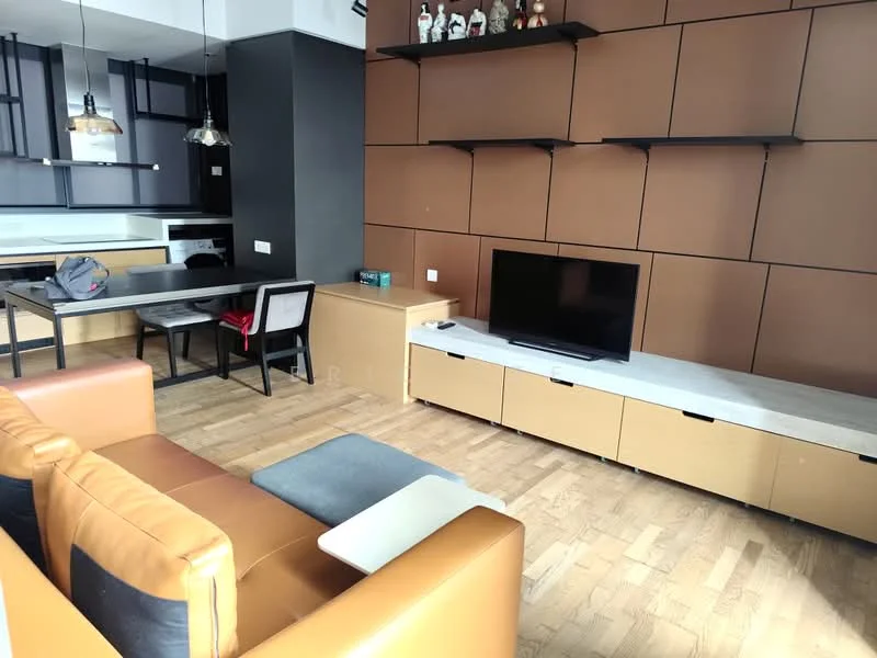Living features: brown accent wall, light wood flooring, 3-seater leather sofa in orange, coffee table, wall-mounted TV, TV console with storage, pendant lighting, dining table with chairs, open kitchen layout, decorative figurines on shelf; style: modern.