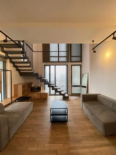 Living features: wood flooring, large floor-to-ceiling windows, open staircase with metal railing, 2-seater fabric sofa in beige, 2-seater fabric sofa in grey, black coffee table, wooden sideboard, full-length mirror, decorative wall lighting, high ceiling, neutral wall color; style: modern; view: city.