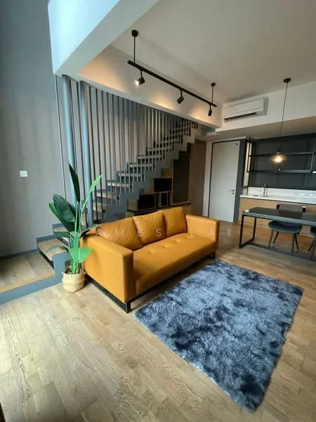 Living features: 3-seater fabric sofa in mustard yellow, area rug with geometric pattern in grey, wooden flooring, recessed downlights, exposed staircase with metal railing, floor-to-ceiling windows, indoor plant in ceramic pot, open layout to kitchen, wall-mounted air conditioning unit; style: modern. Kitchen features: kitchen island, black cabinetry, white countertop, built-in oven, stainless-steel sink, chrome pull-down faucet, open shelving, refrigerator, pendant lighting; style: modern.