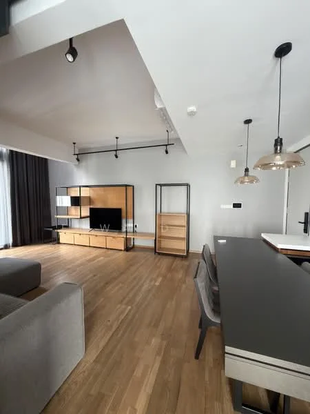 Living features: grey fabric sofa, wooden coffee table, TV console with wooden cabinetry, wall-mounted TV, pendant lights, track lighting, large windows with sheer curtains, wooden flooring, open layout, decorative shelving unit, dining table with chairs; style: modern.