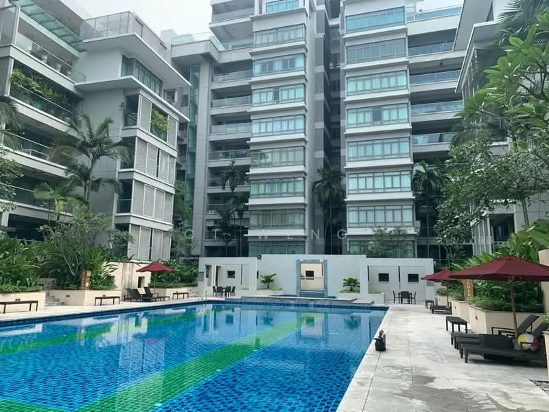 Exterior type: mid-rise condominium; features: swimming pool with blue mosaic tiles, pool deck with loungers, landscaped garden with tropical plants, multiple levels of residential units, glass curtain wall facade, outdoor seating areas with umbrellas, manicured lawn, surrounding palm trees; style: modern.