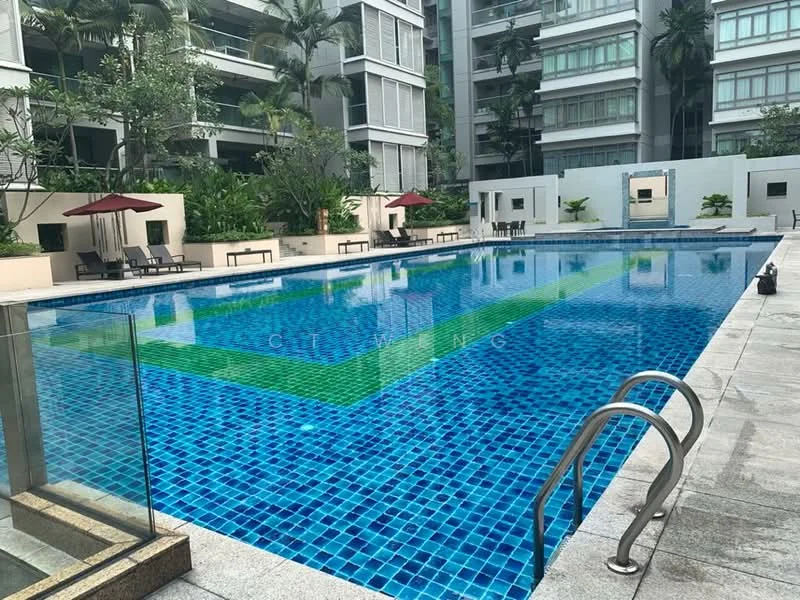 Exterior type: swimming pool deck; features: infinity pool, blue mosaic tile pool surface, surrounded by palm trees, pool deck with loungers, two red umbrellas, landscaped greenery, concrete pool edge, glass railing; style: modern.
