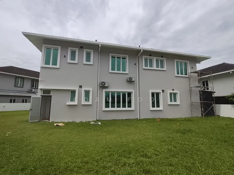 Exterior type: detached bungalow; features: grey painted facade, multiple windows with green frames, 2 wall-mounted split AC units, manicured lawn, scaffolding on one side, single-storey structure, flat roof; style: modern.