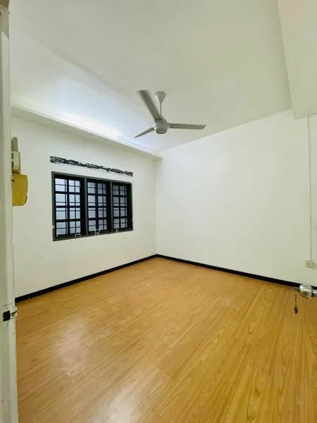 Room features: white painted walls, wooden flooring, 5-blade ceiling fan, black window frames, 4-pane windows, no visible furniture.