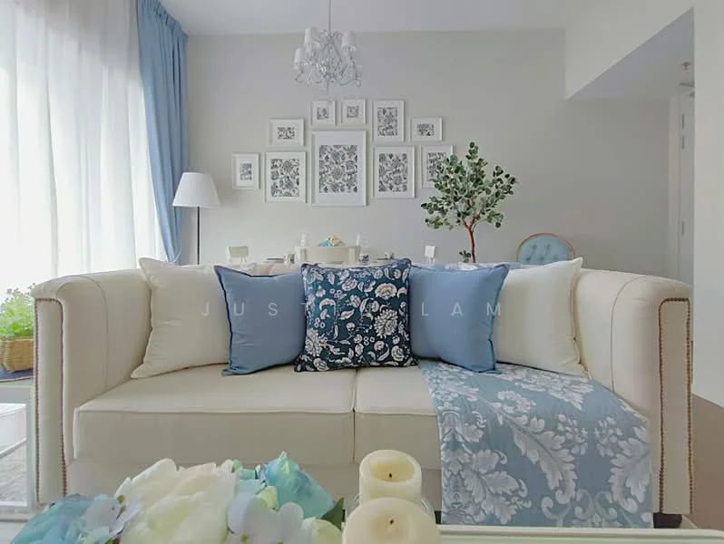 Living features: cream fabric sofa, blue decorative pillows, light blue throw blanket, glass chandelier, white sheer curtains, decorative wall art, green potted plant, wooden coffee table, area rug with floral pattern, wall-mounted mirror; style: modern.