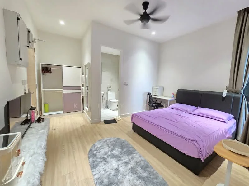 Bedroom features: king-size bed with purple bedding, upholstered headboard, wooden flooring, ceiling fan, wall-mounted TV, study desk with chair, area rug with grey color, window with curtains, built-in wardrobe, decorative wall panel, light-colored walls; style: modern. Bathroom features: one-piece toilet, shower area with glass enclosure, tile cladding, vanity with sink, mirror, light-colored walls.