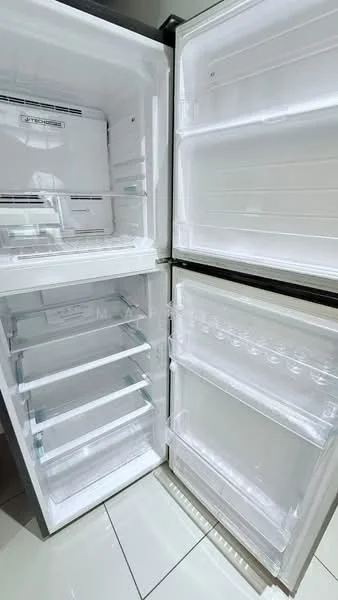 Room features: fridge, double-door fridge, clear glass shelves, transparent storage bins, white interior, metal frame, no visible food items, built-in design; style: modern.