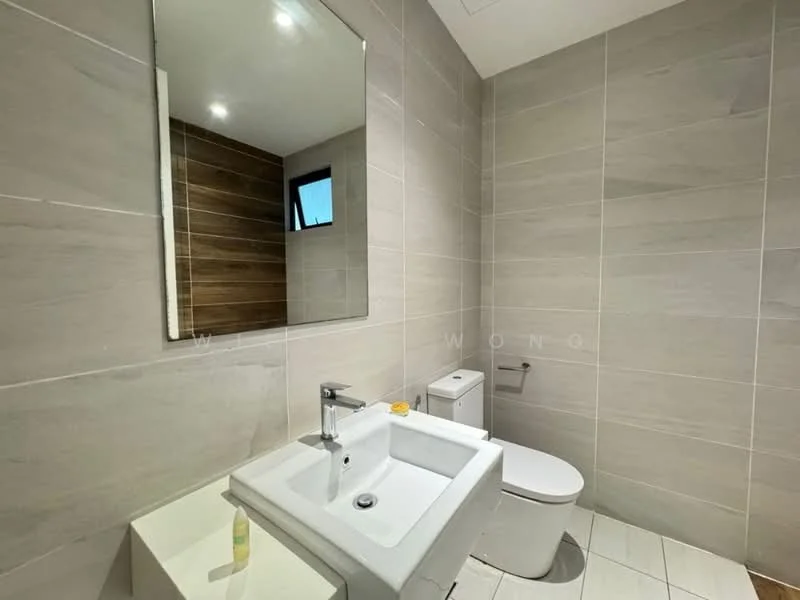 Bathroom features: white ceramic sink, chrome basin mixer faucet, white one-piece toilet, framed mirror, tile cladding on walls, light grey tile flooring, wood accent wall, recessed downlights; style: modern.