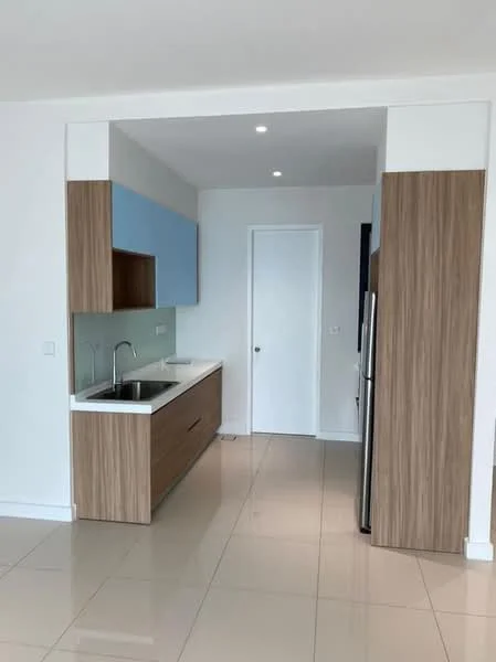 Kitchen features: single-bowl stainless-steel sink, chrome pull-down faucet, white quartz countertop, wood cabinetry with light wood finish, blue upper cabinets, stainless-steel refrigerator, ceramic tile flooring, recessed LED downlights, plain white walls, door leading to another room; style: modern.