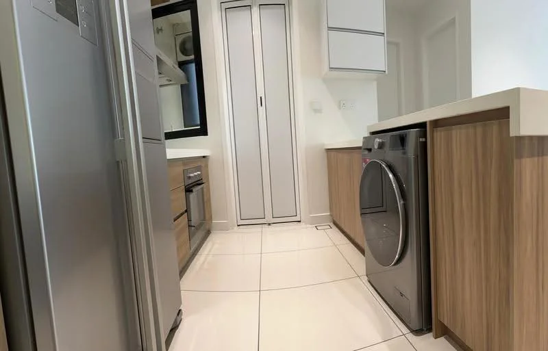 Kitchen features: stainless-steel fridge, built-in oven, freestanding washing machine, laminate cabinetry in light wood, white countertop, ceramic tile flooring, mirror backsplash, recessed downlights, single-bowl stainless-steel sink, chrome pull-down faucet; style: modern.