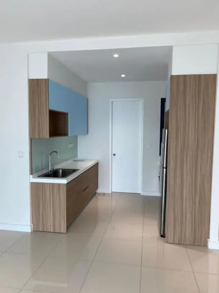 Kitchen features: single-bowl stainless-steel sink, chrome pull-down faucet, white laminate countertop, blue upper cabinets, wood lower cabinets, stainless-steel fridge, built-in oven, ceramic tile flooring, recessed downlights, white painted walls, door to hallway; style: modern.