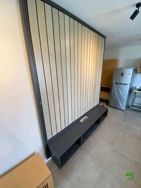 Room features: wood panel accent wall, grey cabinetry, built-in shelf unit, refrigerator, tile flooring, light-colored walls, kitchen countertop, kitchen cabinetry; style: modern.