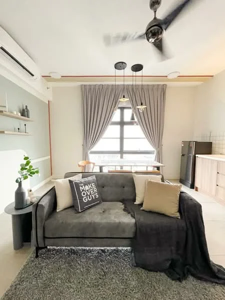 Living features: 3-seater fabric sofa in grey, decorative throw pillow with text, area rug with textured pattern, ceiling fan with light, floor-to-ceiling windows, sheer curtains, wooden dining table, black refrigerator, open shelving, wall-mounted air conditioning unit, light wood cabinetry, hanging pendant lights; style: modern.