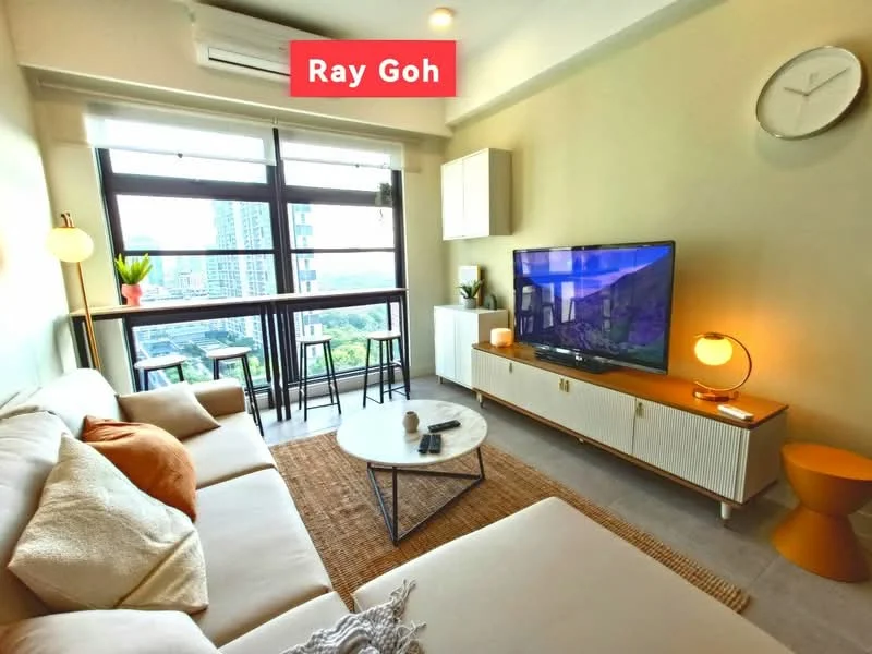 Living features: 3-seater fabric sofa in beige, coffee table with round top, TV console with storage, wall-mounted TV, pendant lamp, floor-to-ceiling windows, city view, area rug with natural fibers, decorative plant, wall clock, light-colored walls, recessed downlights, open shelving unit; style: modern; view: city.