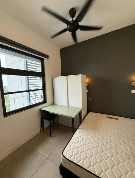 Bedroom features: queen-size bed, black ceiling fan, desk with green tabletop, black chair, two wall-mounted sconces, large window with black frame, grey accent wall, light-colored tiled flooring; style: modern.