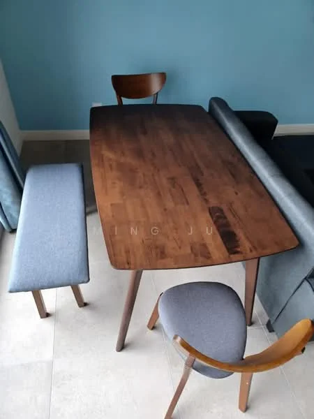 Dining features: wooden dining table with tapered legs, two wooden dining chairs with curved backs, upholstered bench seat, light grey upholstery on bench, blue accent wall, neutral tile flooring, natural wood finish on table, modern design; style: modern.