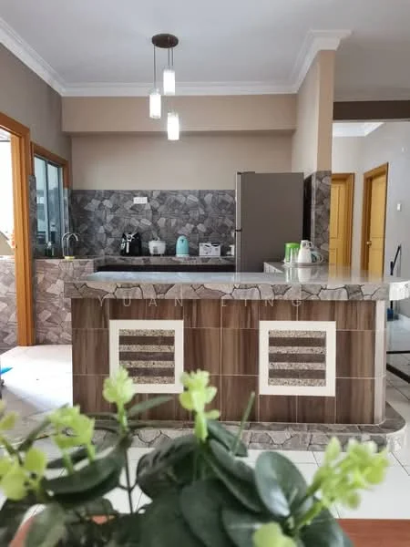 Kitchen features: grey and brown patterned tile backsplash, brown wooden cabinetry, stainless-steel fridge, built-in countertop with decorative stone, kitchen island with seating, pendant lighting, sink with faucet, window with view to outside, kettle, toaster, microwave; style: modern.