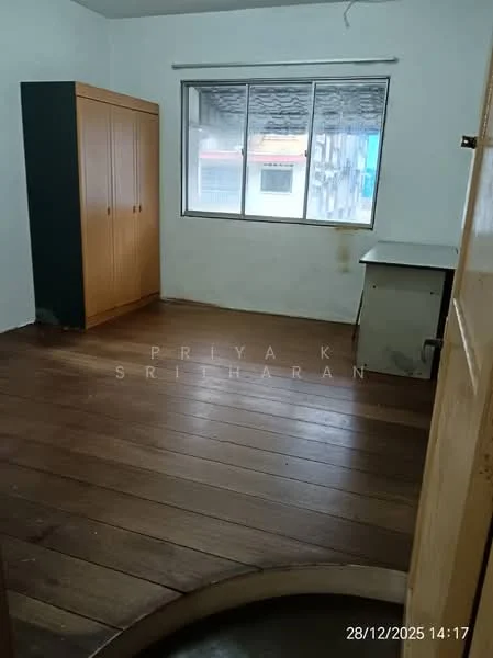 Room features: wooden flooring, white painted walls, large window, built-in wardrobe with wooden finish, desk or table, ceiling light fixture.
