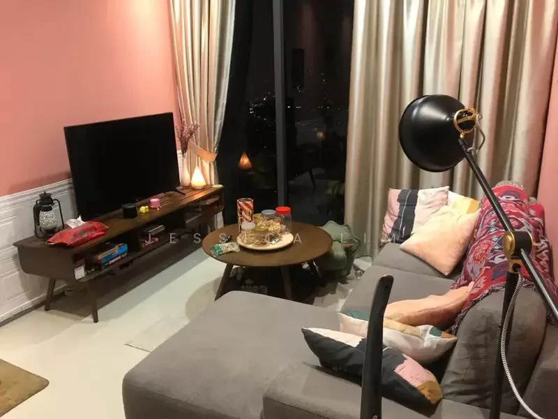 Living features: grey fabric L-shape sectional sofa, wooden coffee table, wall-mounted TV, TV console with drawers, decorative cushions in various colors, pink painted walls, floor-to-ceiling windows, curtains in light beige, area rug, snack bowl on coffee table, decorative items on console; style: modern; view: city.