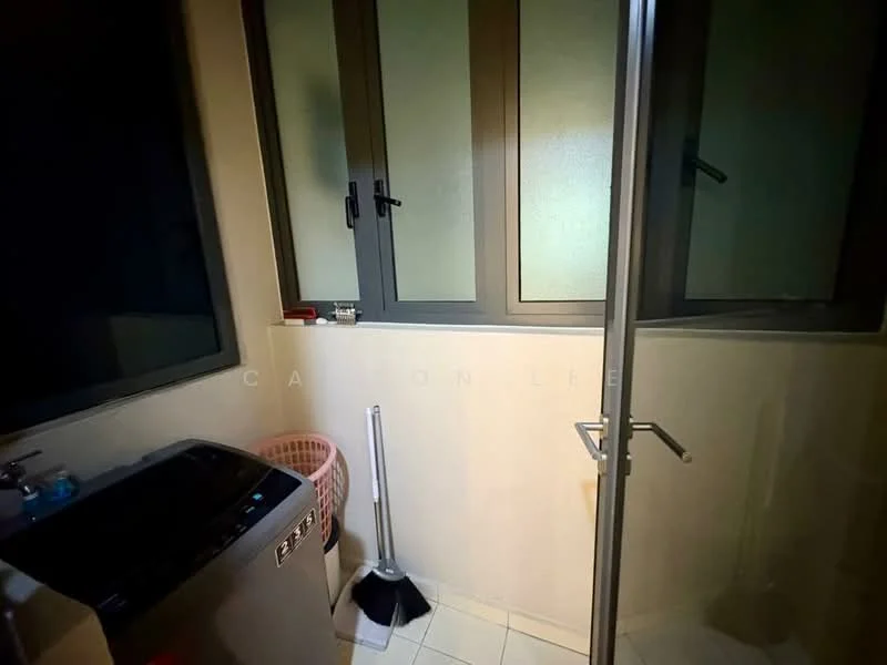 Laundry features: front-load washing machine, glass shower enclosure, tiled flooring, grey walls, window with frosted glass, sliding window, cleaning broom, pink laundry basket.