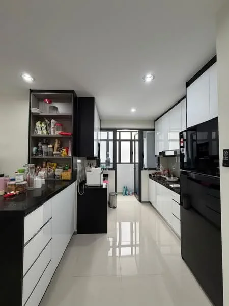 Kitchen features: black and white cabinetry, black countertop, white upper cabinets, built-in black fridge, built-in oven, stainless-steel sink, chrome pull-down faucet, open shelving, tile flooring, recessed downlights, window with grid pattern, kitchen island, appliances on countertop; style: modern.