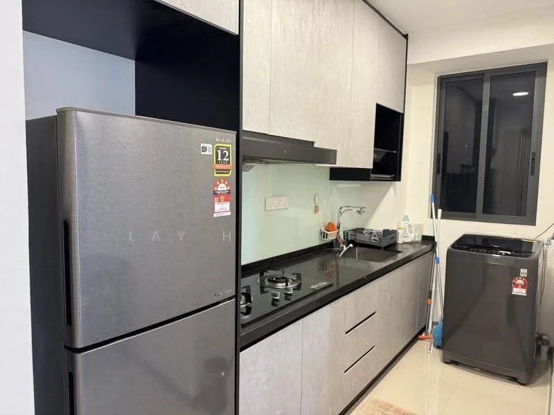 Kitchen features: grey cabinetry, black countertop, stainless-steel fridge, built-in gas stove, stainless-steel sink, chrome pull-down faucet, wall-mounted cabinets, black washing machine, tile backsplash, recessed lighting, window with view, floor tiles, cleaning supplies visible; style: modern.