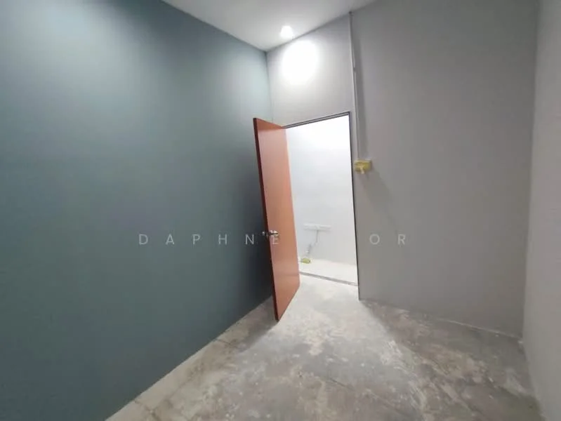 Room features: grey painted walls, blue accent wall, concrete flooring, door with wooden finish, ceiling light fixture; style: modern.