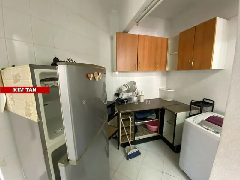 Laundry features: stainless-steel fridge, wooden upper cabinets, countertop workspace, washing machine, tile flooring, white tiled walls, sweeping broom, pink storage bin.