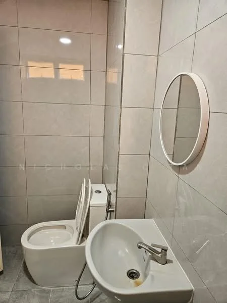 Bathroom features: white ceramic toilet, round mirror, single-bowl sink, chrome faucet, grey tile flooring, white wall tiles, white tiled walls, bidet spray; style: modern.