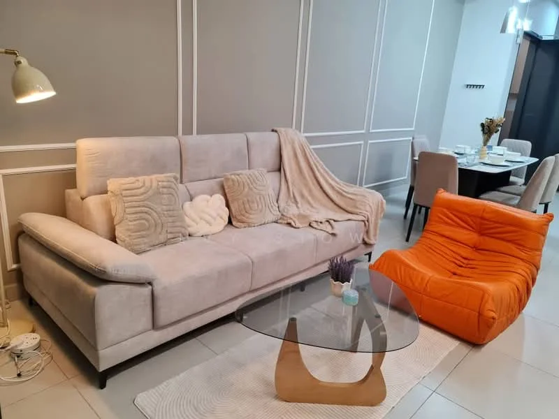 Living features: 3-seater fabric sofa in light beige, orange lounge chair, glass coffee table with wooden base, white throw blanket, decorative cushions, wall-mounted light fixture, neutral painted walls, tile flooring; style: modern.