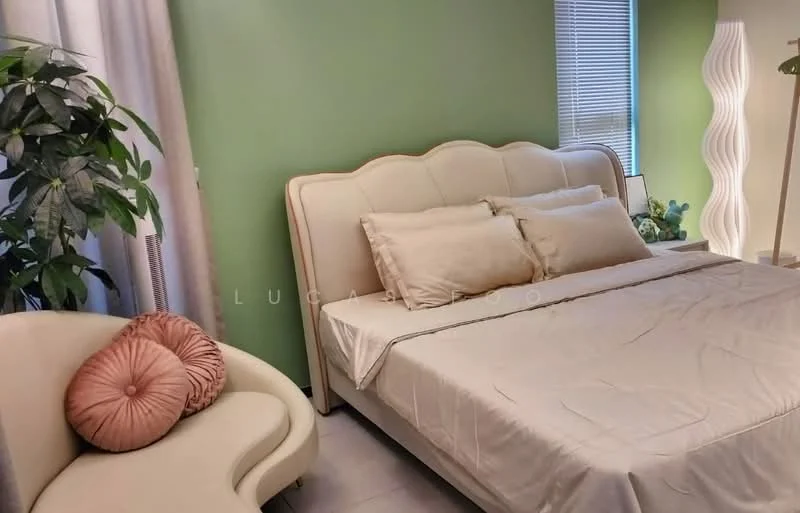 Bedroom features: green painted walls, queen-size bed with upholstered headboard, two beige pillows, floor-to-ceiling window with blinds, decorative floor lamp, light-colored bedding, curtains, potted plant, beige accent chair with pink cushion; style: modern.