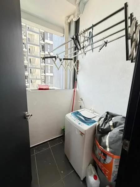 Laundry features: washing machine, clothes drying rack, grey tiled flooring, white painted walls, window for natural light, plastic laundry basket, cleaning supplies, shelf for storage.