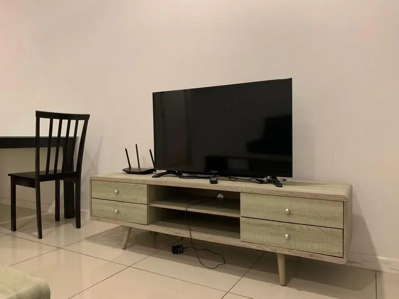 Living features: flat-screen TV on media console, wooden media console with drawers, black chair, white walls, glossy tile flooring, router on media console, cable management visible, minimalist decor; style: modern.