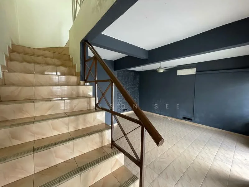 Room features: staircase with metal railing, cream tiled flooring, grey accent wall, white walls, ceiling fan, open space layout, natural light from windows, no visible furniture; style: modern.