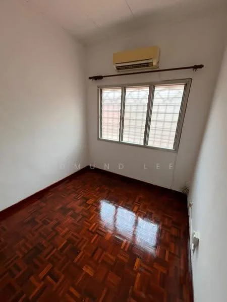 Room features: white painted walls, parquet wood flooring, 1 wall-mounted split AC, 3-pane window, curtain rod, natural light from window.