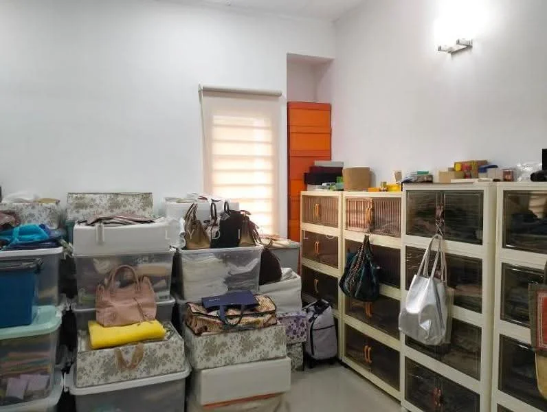 Room features: white painted walls, glossy tile flooring, window with sheer blinds, built-in cabinets with glass doors, plastic storage bins in various colors, stacked boxes, handbags and purses, orange storage unit, overhead wall lighting; style: modern.