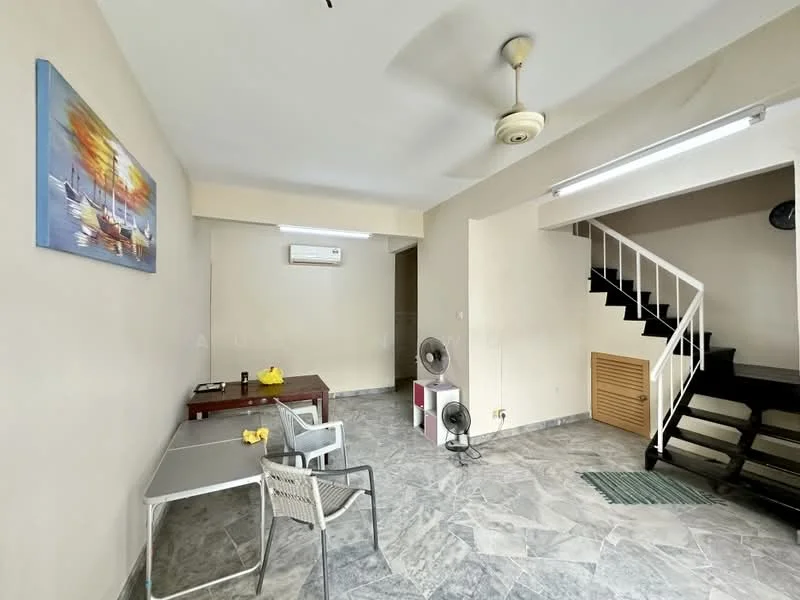 Living features: grey marble flooring, cream painted walls, 5-blade ceiling fan with light, wall-mounted split AC, wooden staircase, table with 2 chairs, decorative painting on wall, 2 standing fans, green area rug; style: modern.