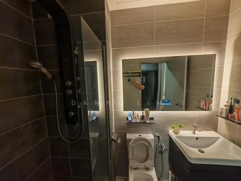Bathroom features: walk-in shower with glass enclosure, rain shower head, handheld shower, single-sink vanity with dark wood cabinet, chrome basin mixer, framed mirror with LED backlighting, one-piece toilet, tile cladding on walls, grey ceramic tile flooring, wall-mounted shelf with toiletries, decorative plant on vanity; style: modern.