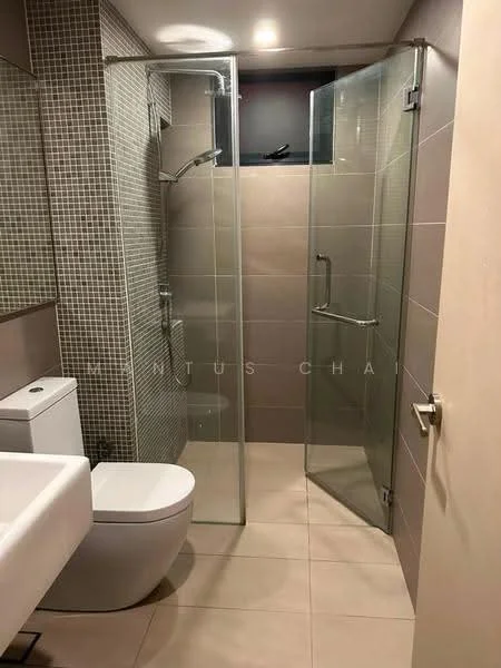 Bathroom features: walk-in shower with glass enclosure, chrome handheld shower, chrome wall-mounted faucet, one-piece toilet, framed mirror, tile cladding on walls, light beige floor tiles, grey mosaic tile accent wall, glass shower door, built-in shower niche; style: modern.