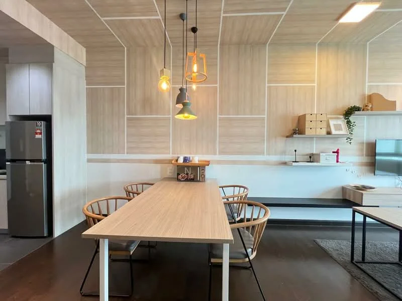 Dining features: wooden dining table, 4 dining chairs with natural wood finish, pendant lighting with multiple bulbs, light wood paneling on walls, dark wood flooring, wall-mounted shelf, TV console, refrigerator, decorative plant, neutral color scheme; style: modern.