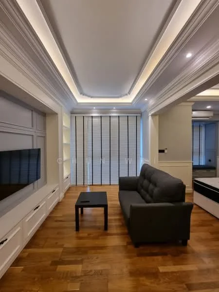Living features: grey fabric sofa, black coffee table, wooden flooring, recessed ceiling lights, crown moulding, built-in cabinetry, wall-mounted TV, sliding glass doors with blinds; style: modern.