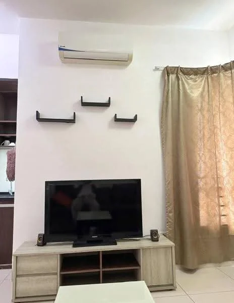 Living features: wall-mounted air conditioning unit, flat-screen TV on wooden TV console, light-colored wooden TV console with storage, decorative wall shelves, curtains in gold color, cream-colored walls, tiled flooring, speakers on either side of TV; style: modern.