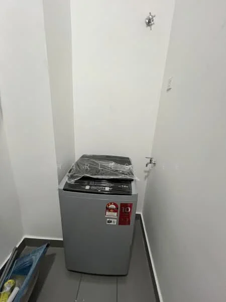Laundry features: top-load washing machine, grey appliance, plastic wrapping on machine, white walls, grey tile flooring.