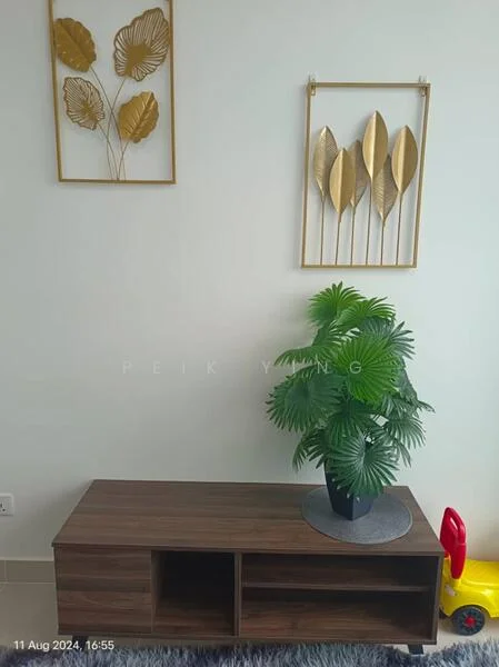 Living features: wooden console table, decorative wall art with gold leaves, green potted plant, light-colored walls, tile flooring, round grey mat under plant, colorful toy in the corner; style: modern.