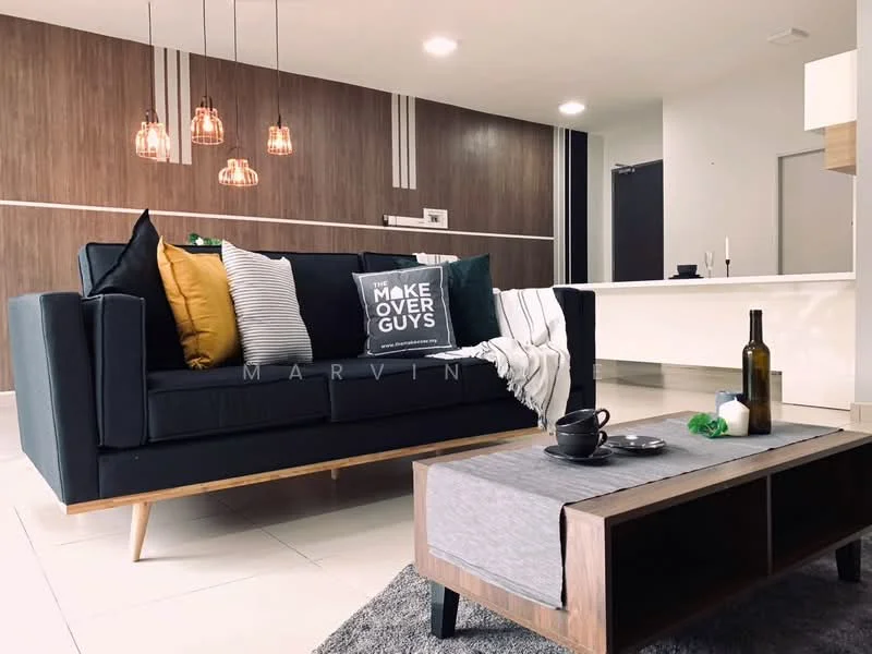 Living features: black fabric sofa, wooden legs on sofa, yellow throw pillow, black and white striped throw pillow, grey throw blanket, wooden coffee table, decorative bottle on table, ceramic cup on table, green decorative item on table, wood panel accent wall, recessed ceiling lights, open kitchen view in background, white cabinetry in background, neutral tile flooring; style: modern.