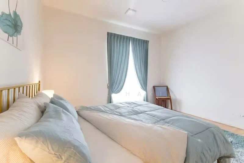 Bedroom features: king-size bed, upholstered headboard, light blue bedding, wooden bedside table, floor-to-ceiling window, sheer curtains, blue area rug, wooden flooring, decorative wall art with leaves, wall-mounted light fixture; style: modern.