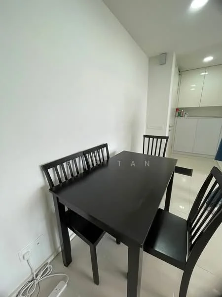 Dining features: black dining table, 4 dining chairs, white painted walls, glossy tile flooring, kitchen cabinetry visible in background, recessed lighting, power outlet on wall; style: modern.